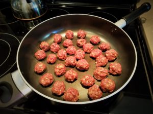 hoisin sauce meatballs in the pan. gluten and dairy free recipe